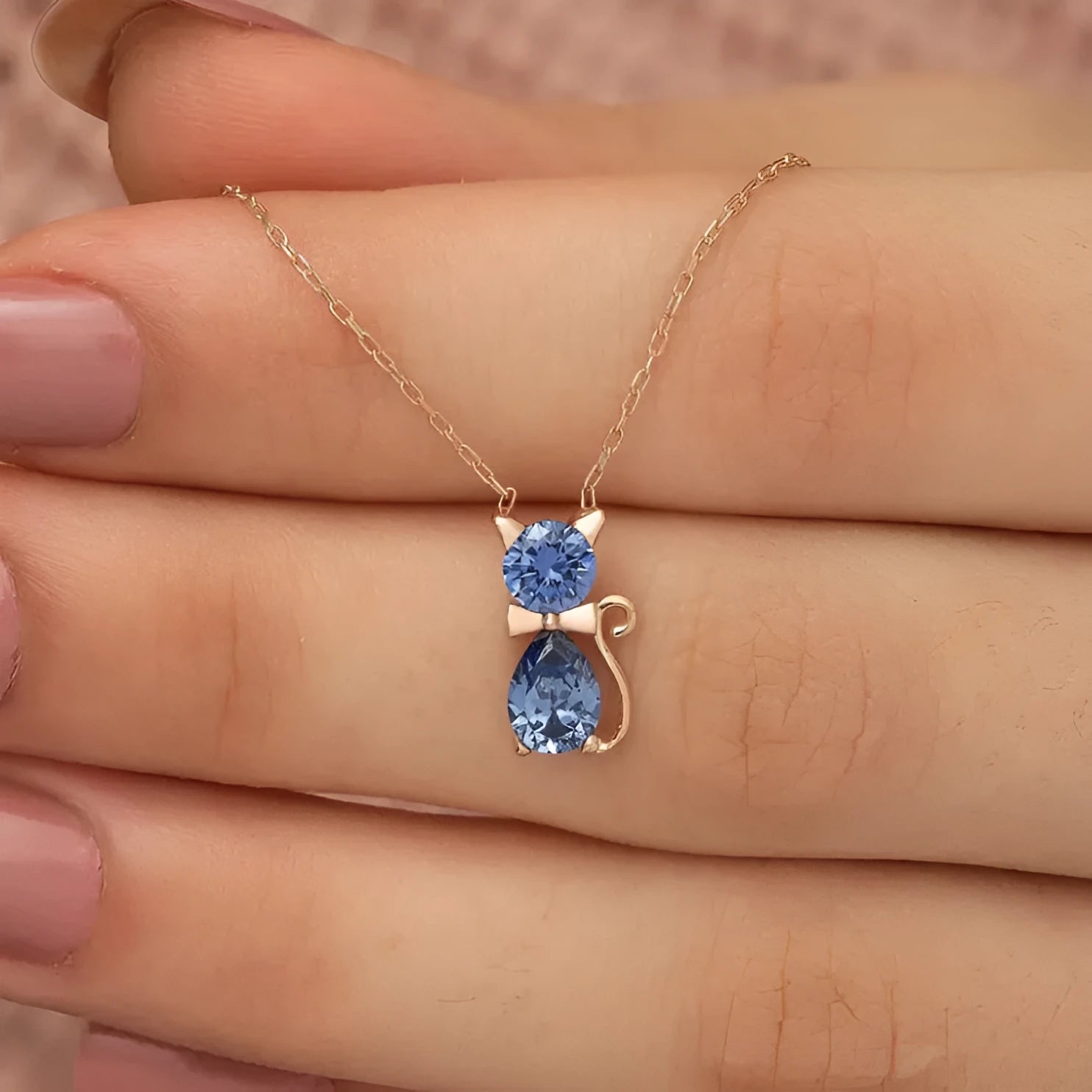 Sweet fashion necklace with titanium steel kitty pendant and coloured zircon stones on copper water wave chain.