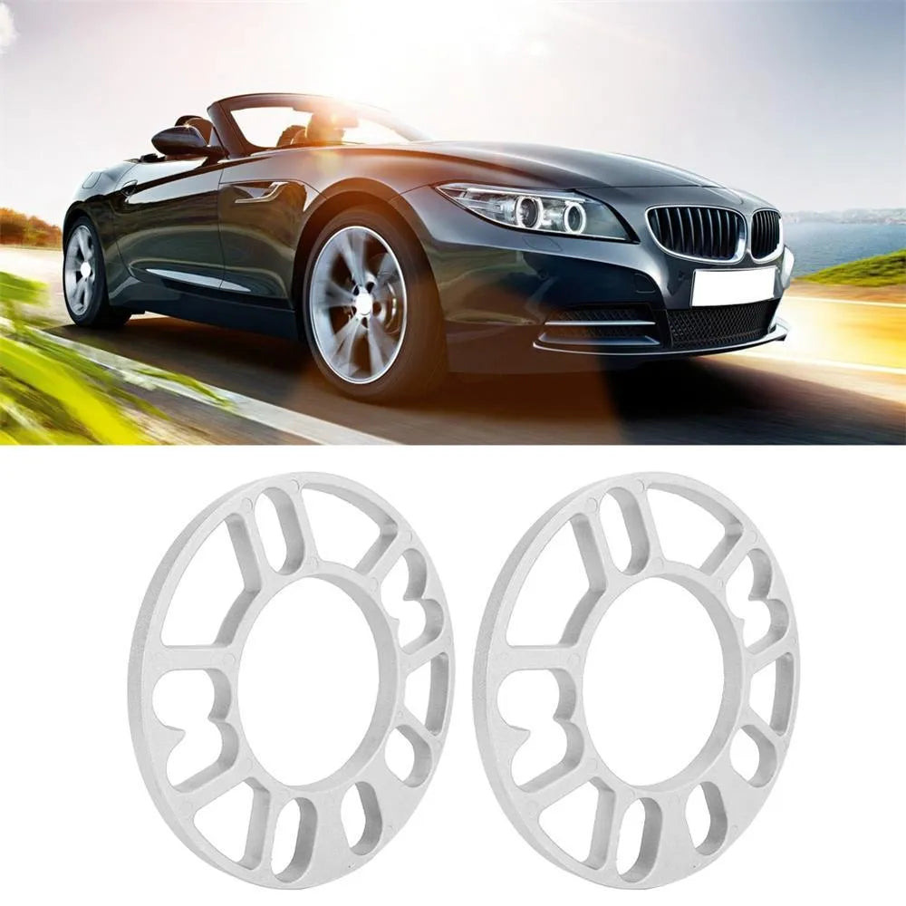 Set of four metal wheel hub widening gaskets in 3mm, 5mm, 8mm, and 10mm thicknesses for automotive modification.