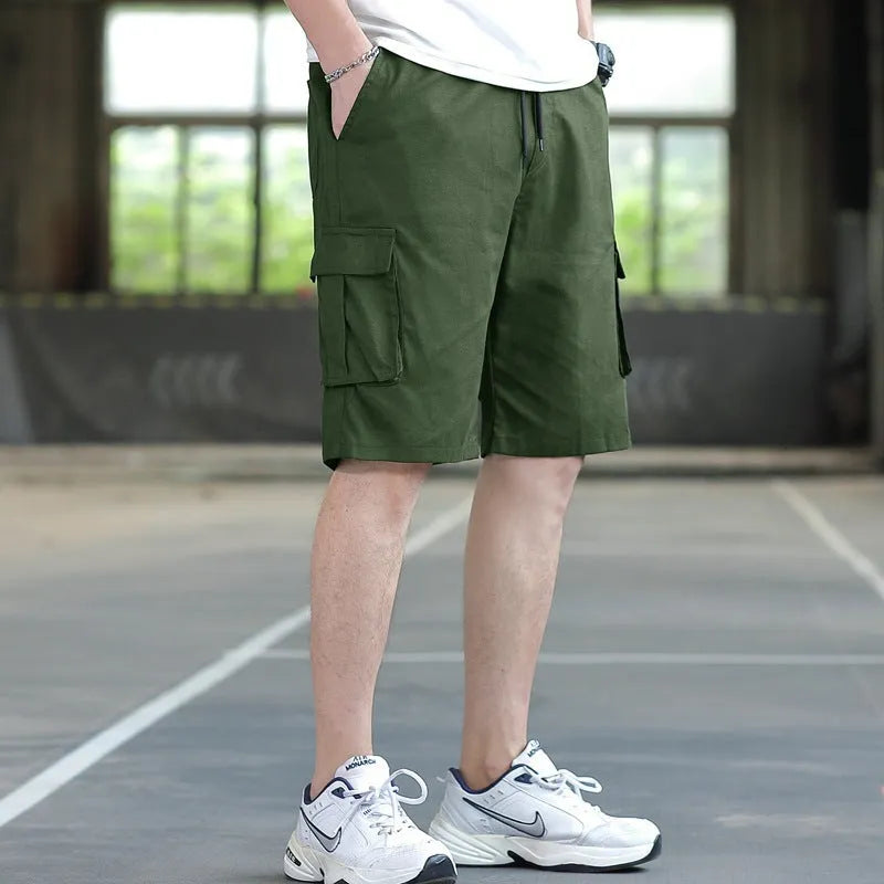 Man modelling loose fit khaki casual trousers with a giraffe pattern gradient detail.