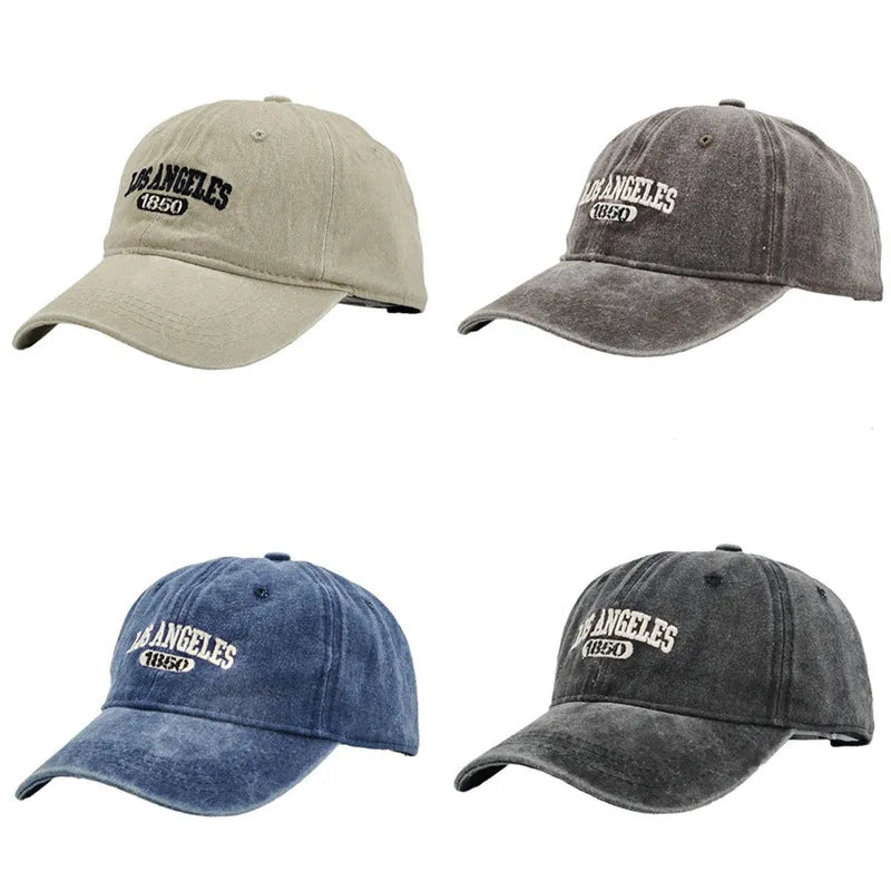 Retro beige personalised washed cotton peaked cap with adjustable strap and embroidered letters on the front.