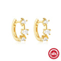 A pair of small round sterling silver geometric stud earrings with a classic diamond detail on a plain background.