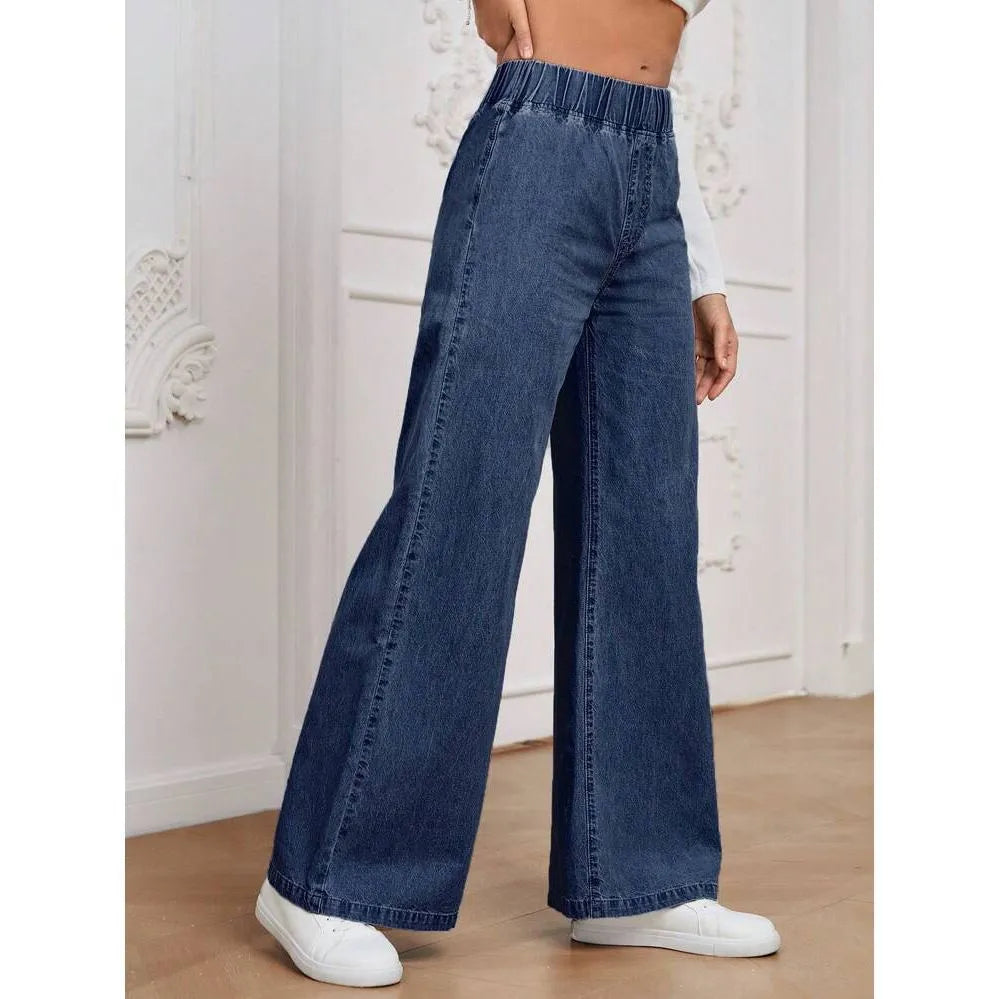 Light blue washed plus size women's wide-leg denim jeans with straight cut and zip fly