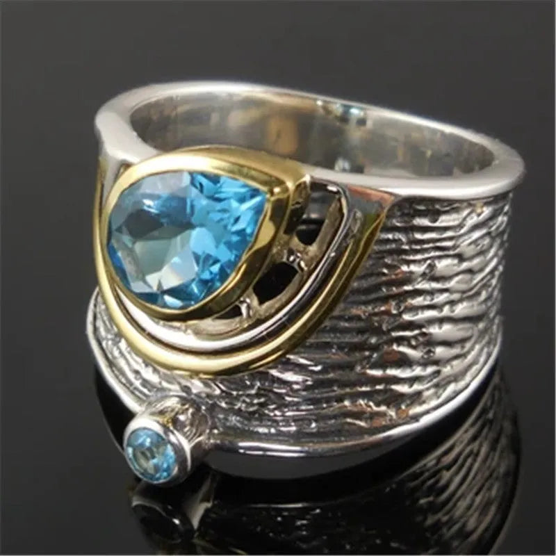 Chinese-style women's ring with blue rhinestones in drop shape design on alloy band