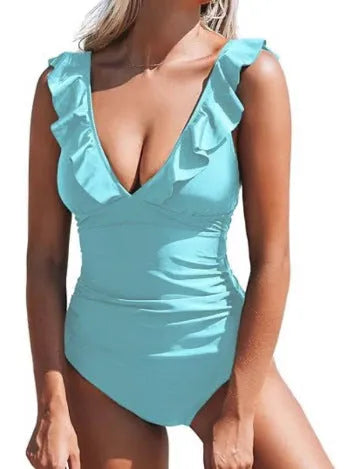 Women's apricot V-neck one-piece swimsuit with lace-up front and flounce detail on a mannequin.