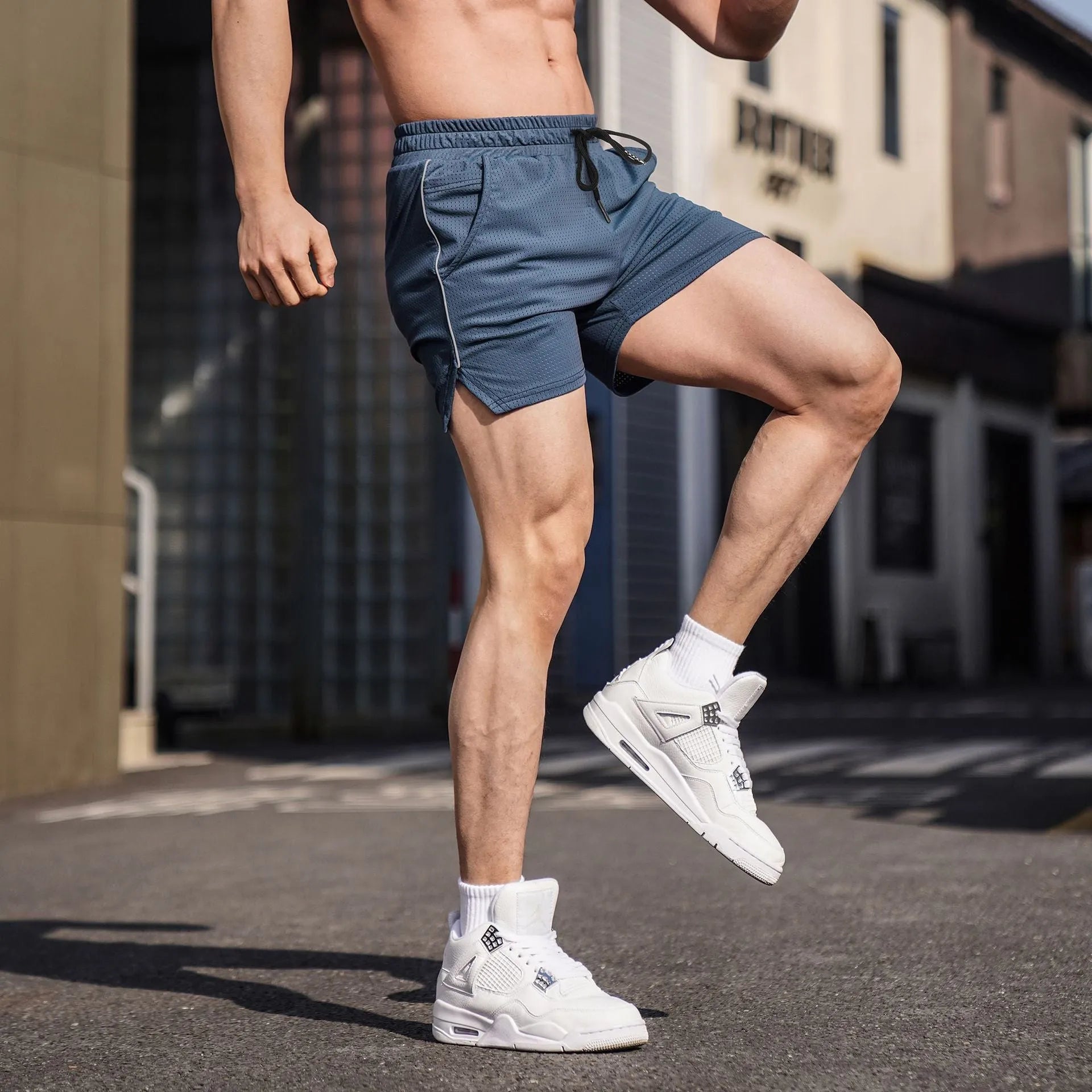 Men's straight-leg polyester sports shorts in black, available in multiple sizes.