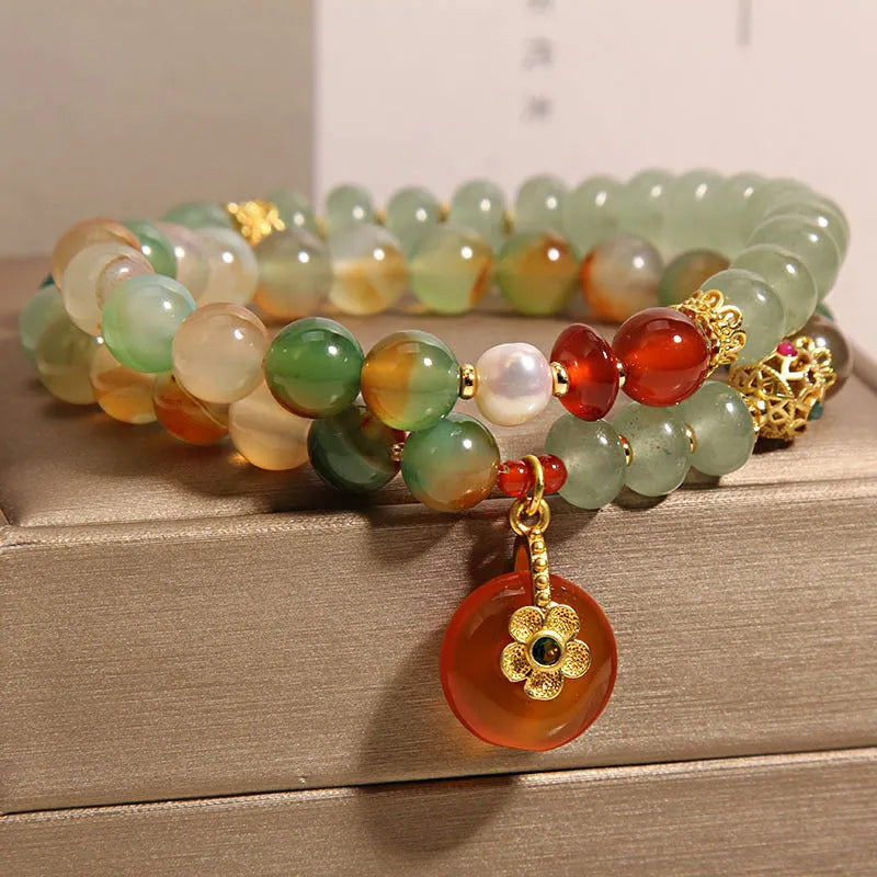 Women's peacock green agate double ring bracelet with alloy construction and safety buckle clasp.