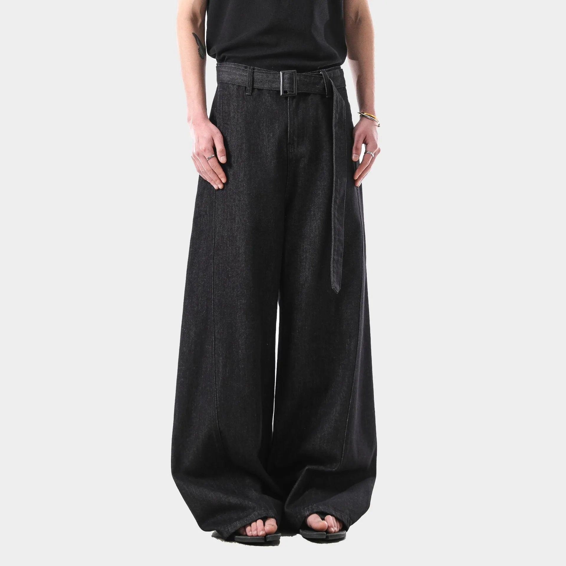 Women's black high-waist straight-leg jeans with retro gold wash detailing on denim.