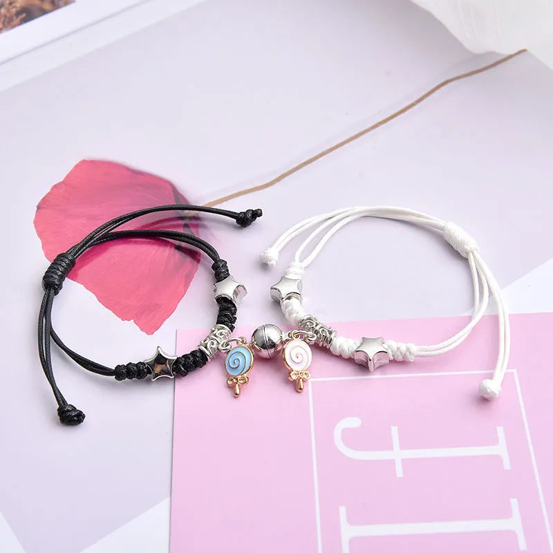 Magnetic couple bracelets with alloy electroplated finish showing multiple design styles including love locks and crown patterns