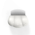 Paw Soft deshedding grooming brush for cats and dogs on a white surface.