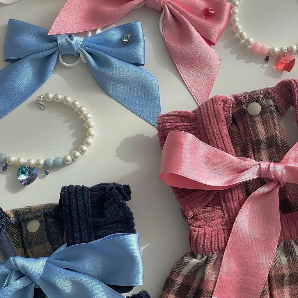 Blue adjustable princess bow hair band on a dog, showing the jacquard ribbon material and tension adjustment.