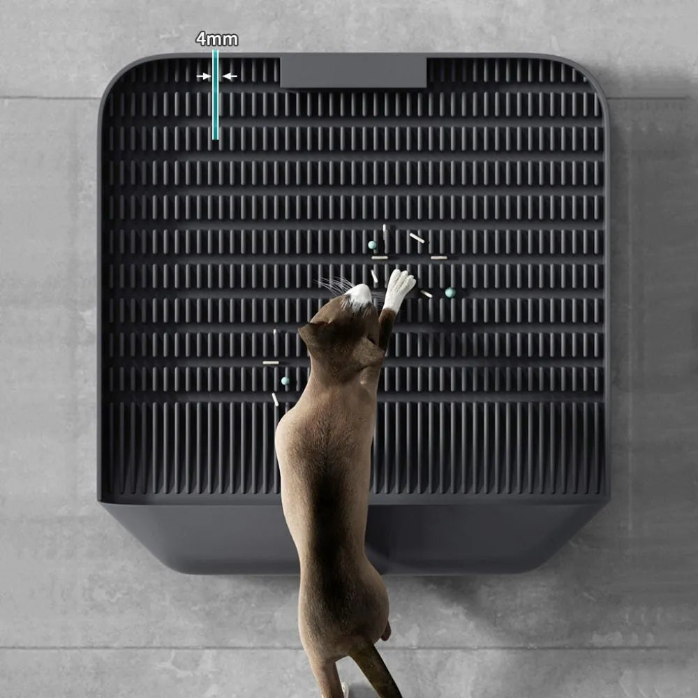 Large square black cat litter pedal mat with slanted design and textured grooves