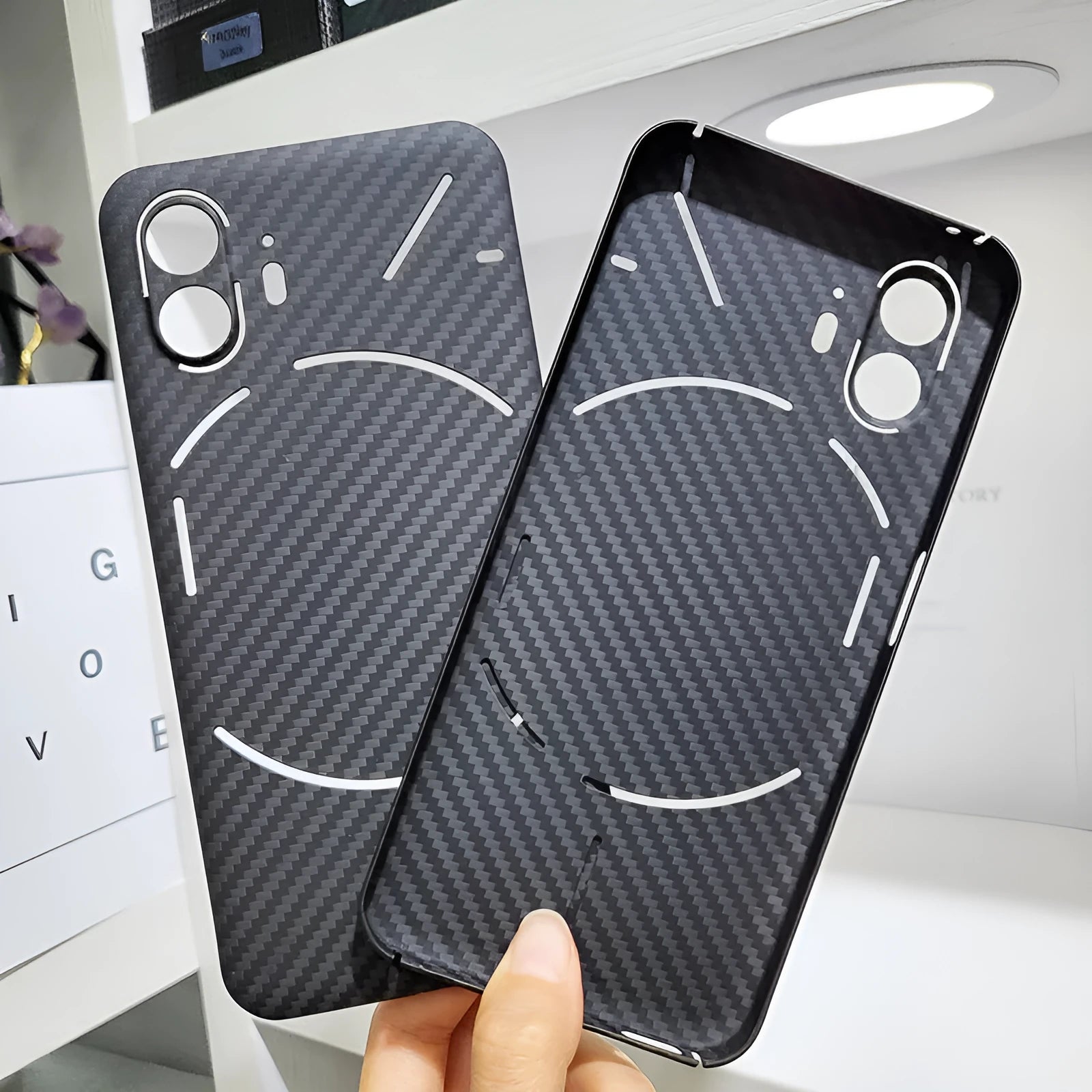 Real aramid fiber phone case in matte black hollow finish for Nothing Phone 2 with plaid texture