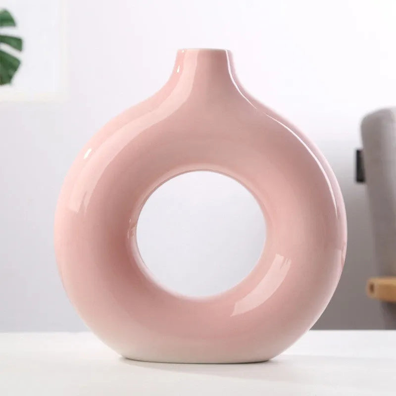 A simple modern frosted porcelain biscuit vase for flower arranging, shown in a neutral colour.