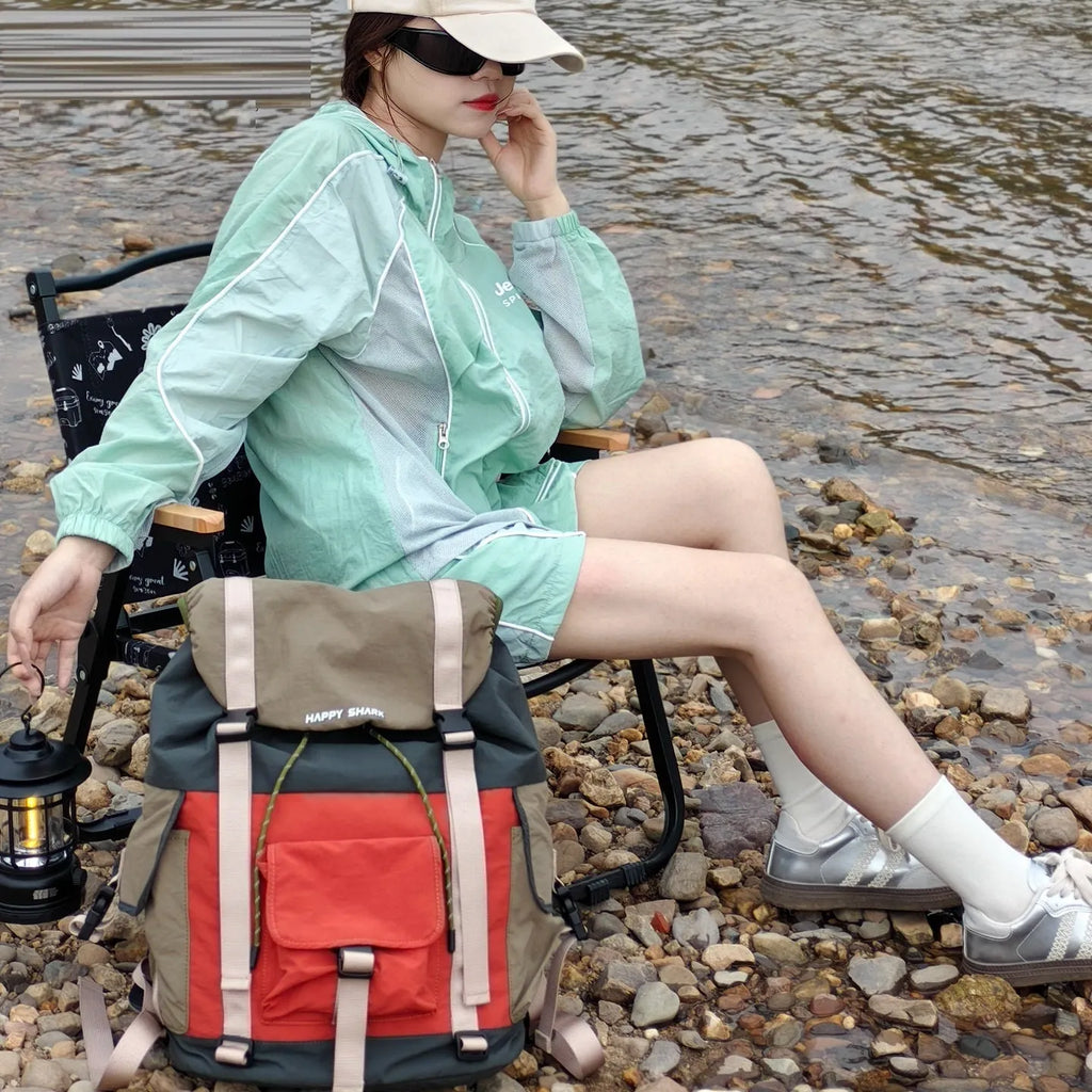 Orange green contrast colour outdoor backpack with multiple compartments and air pillow belt system