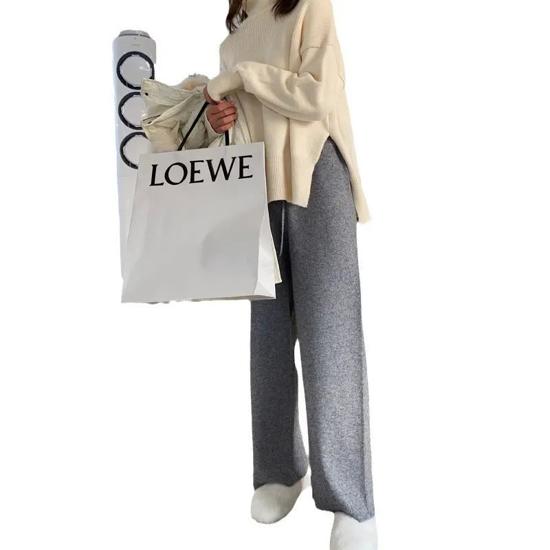Women's high-waist knitted wide-leg trousers in cream white, floor-length design for winter wear