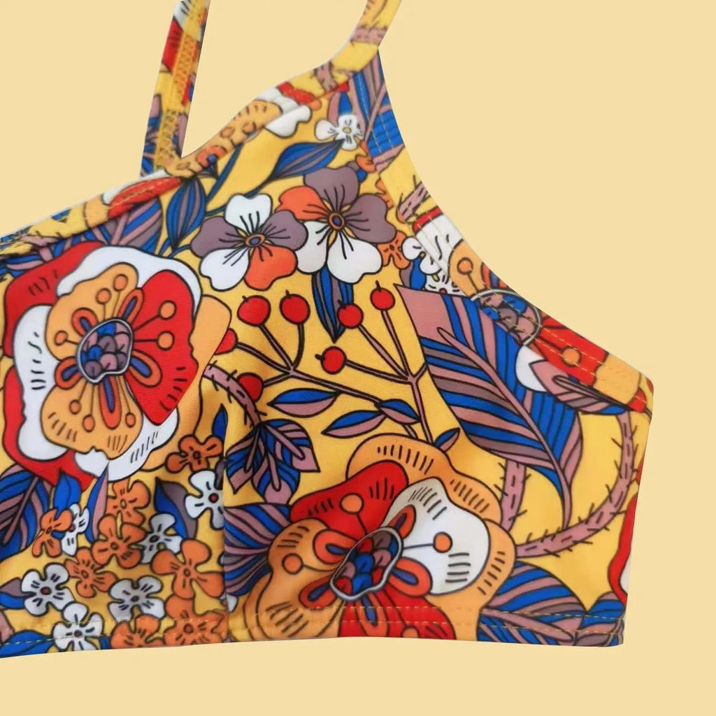 Plus size floral print strap women's bikini swimsuit with briefs style on a hanger.