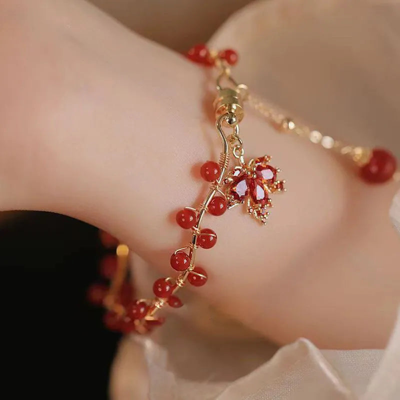 Red ginkgo leaf charm on an alloy magnetic bracelet with Chinese style design.