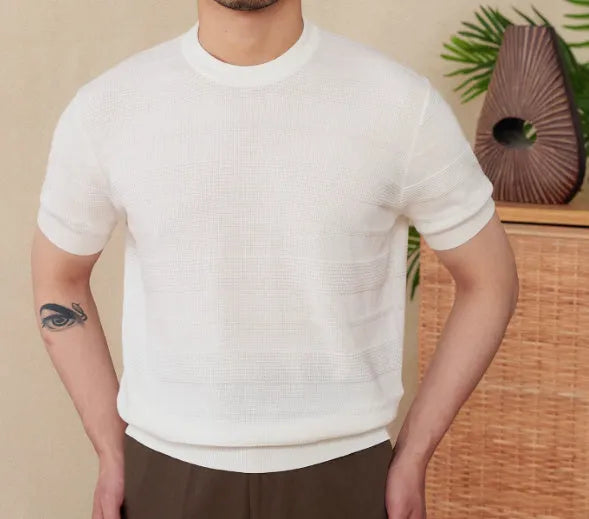 Men's off-white pure cotton short sleeve t-shirt with a round neck, laid flat on a surface.