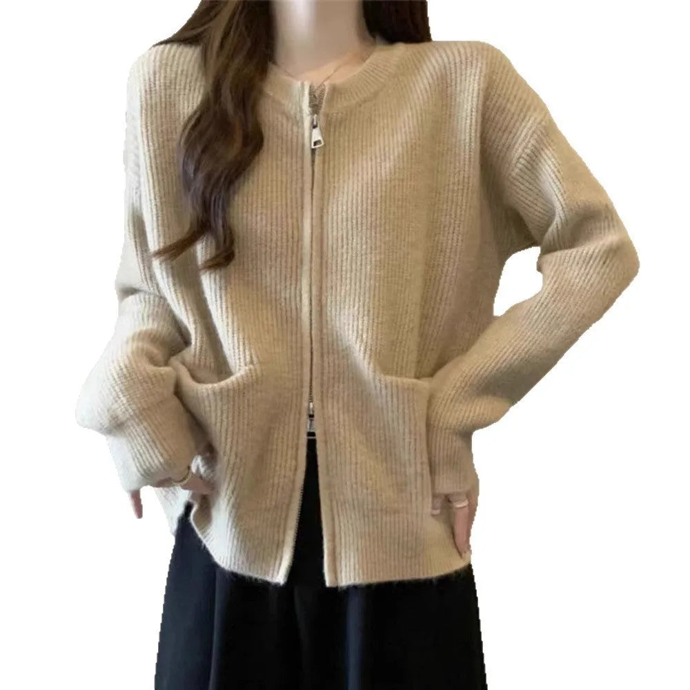 Beige viscose knit sweater coat cardigan with long sleeves laid flat.