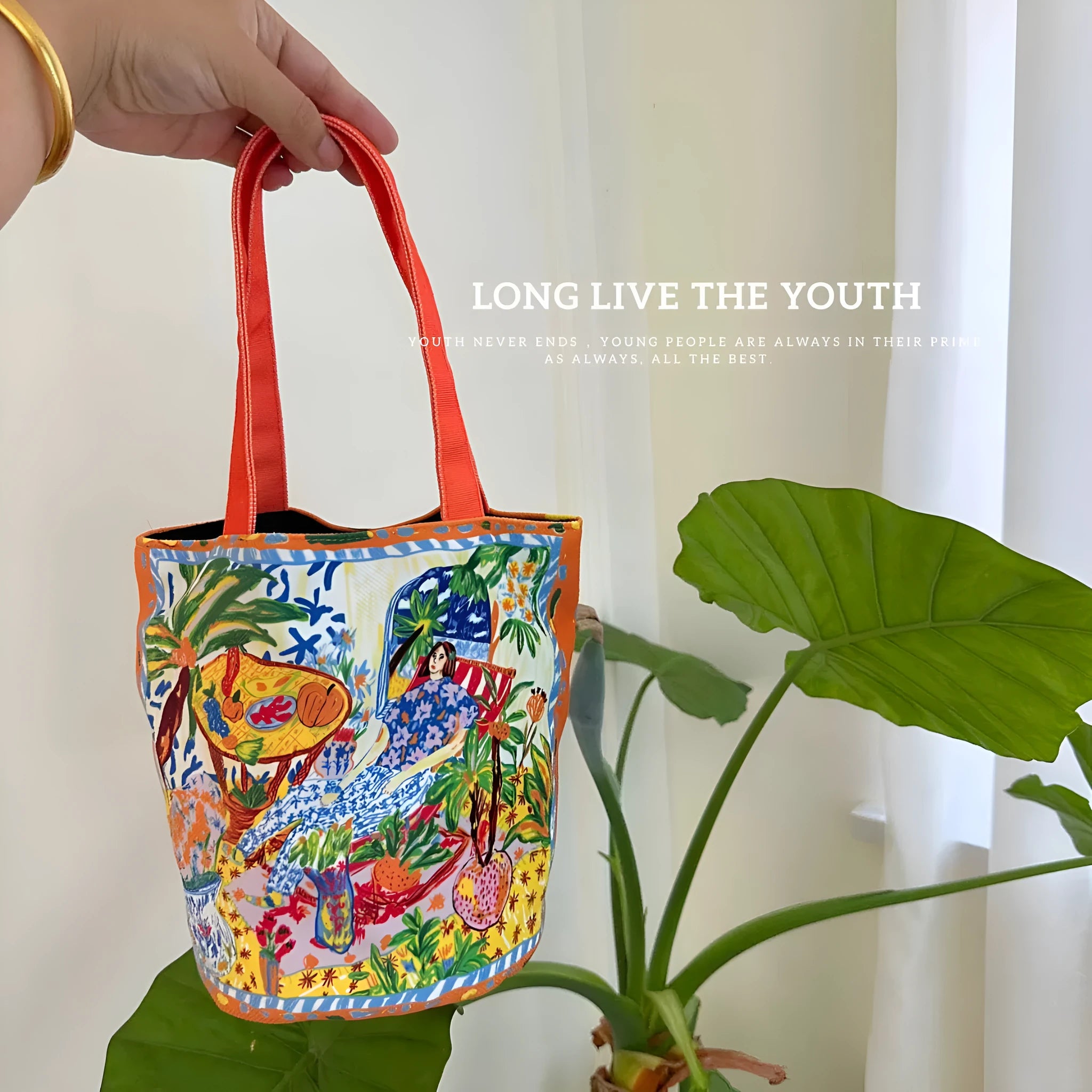 Dream Garden orange plush bucket bag with printed design, canvas lining, and double shoulder straps