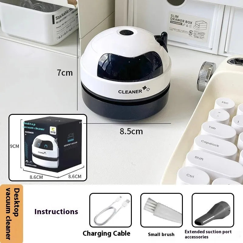 USB handheld desktop vacuum cleaner in blue, showing compact design for keyboard cleaning