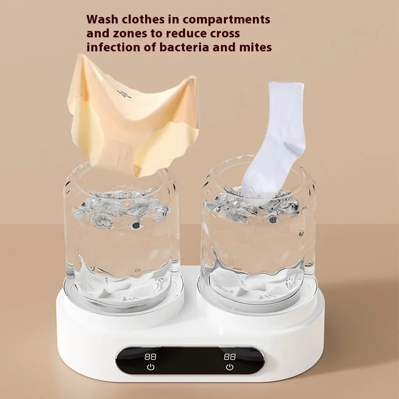 White double-bucket mini USB washing machine with two lids and a USB cable on a countertop.