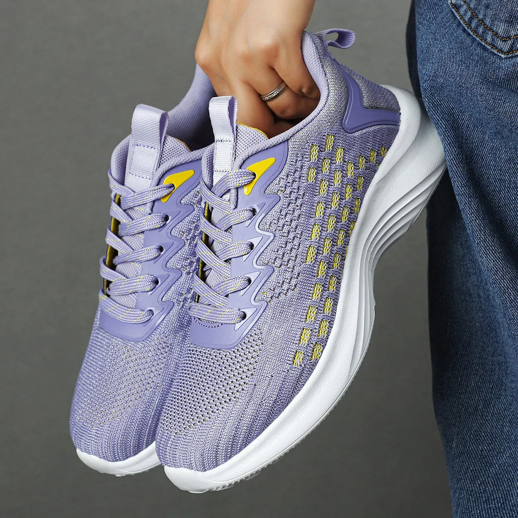 Women's lavender purple and sapphire blue Flyknit running shoes with striped pattern and mesh lining