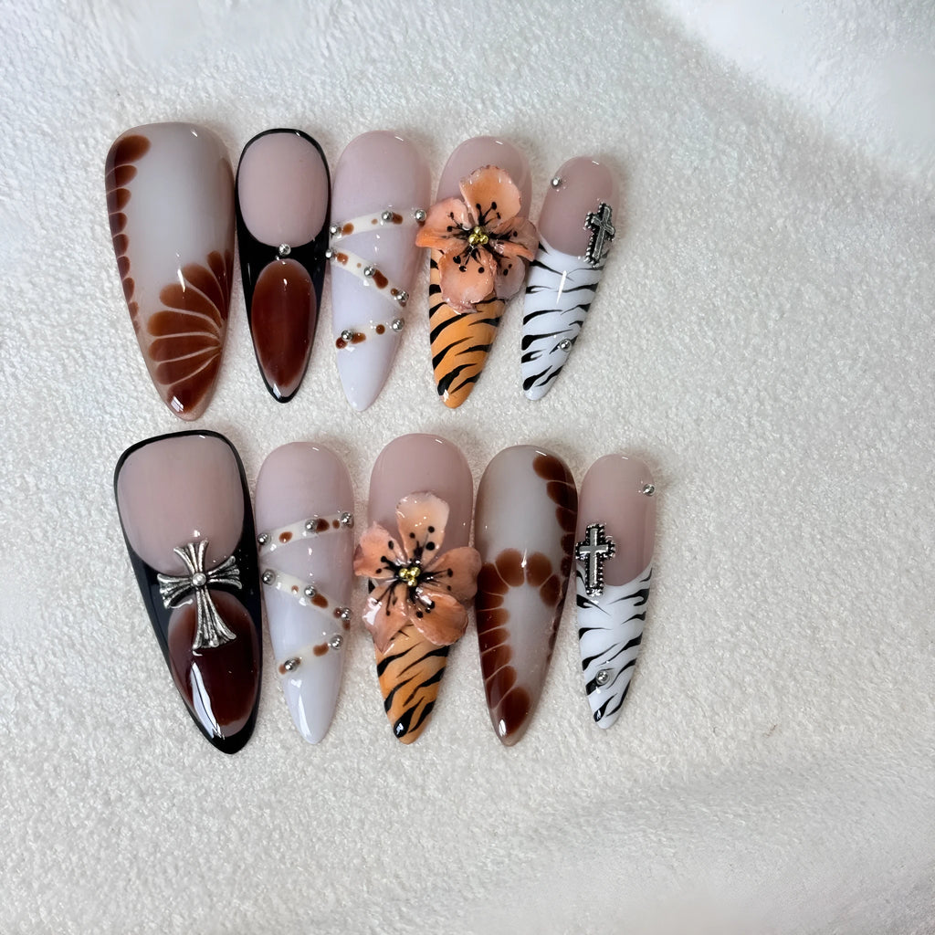 Handmade French style nail stickers with leopard print, cross, and floral patterns in four sizes