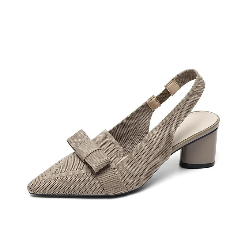 Women's closed toe high heel sandal with back ankle strap in a solid colour, showing pointed toe and fabric upper.
