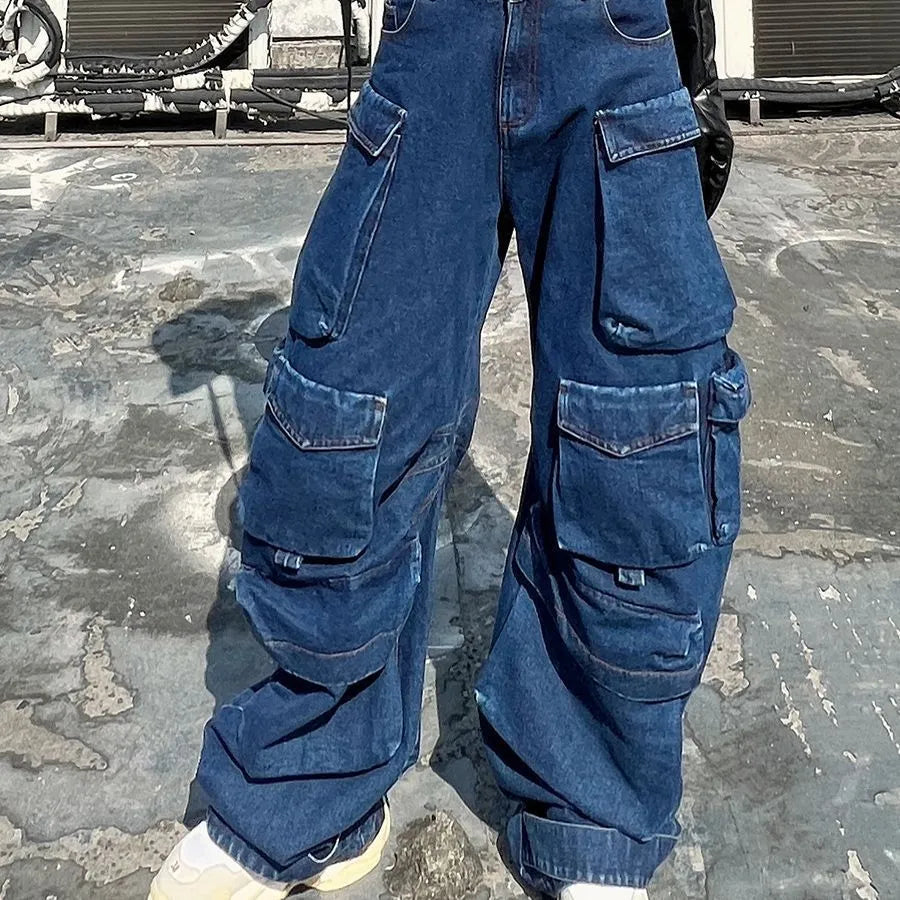 Dark blue distressed wide-leg jeans with a high waist and multiple pockets on a hanger
