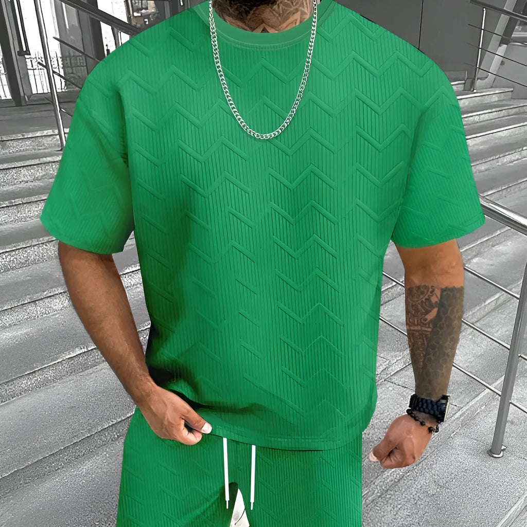 Men's printed short sleeve top and matching shorts leisure suit set on a hanger.