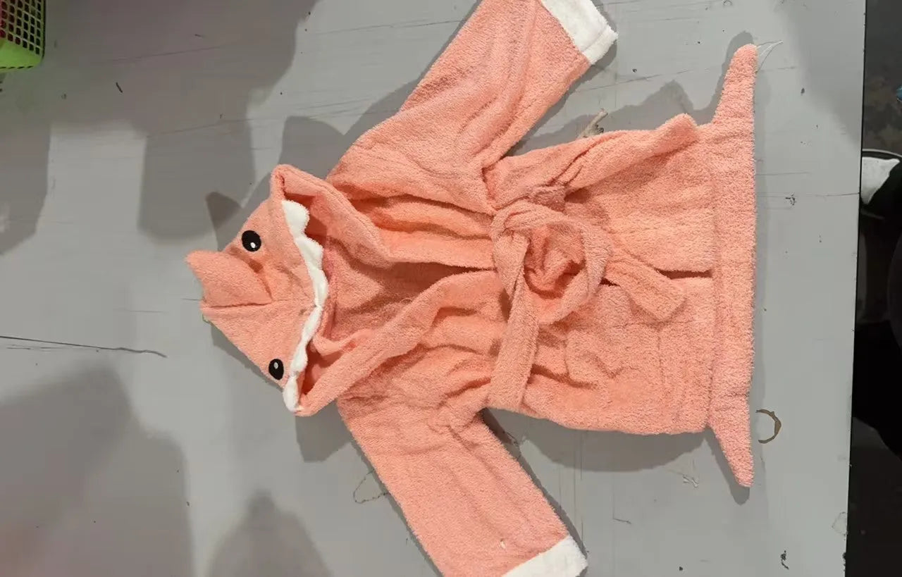 Children's hooded cotton animal-shaped bathrobe in pink with hood and front pocket, soft treatment finish.