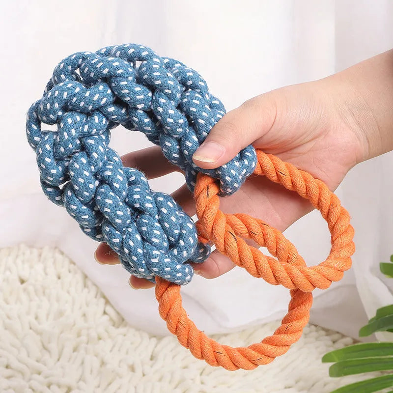 Blue braided cotton rope bone dog toy with double rings at each end for chewing and tooth cleaning