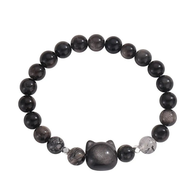 Women's obsidian crystal bracelet with silver cat charm and zodiac animal modelling on adjustable band