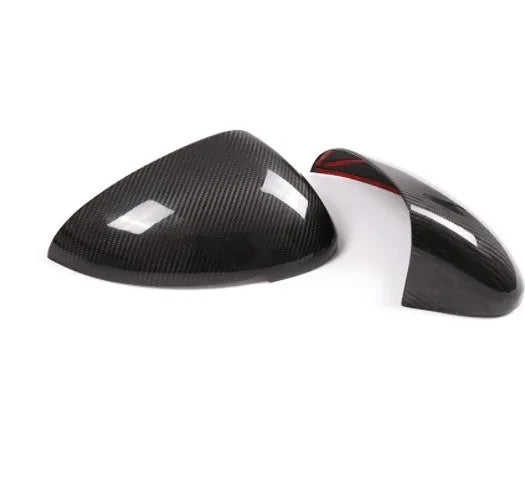 Pair of real carbon fibre rearview mirror covers for Porsche Macan, showing black woven texture.