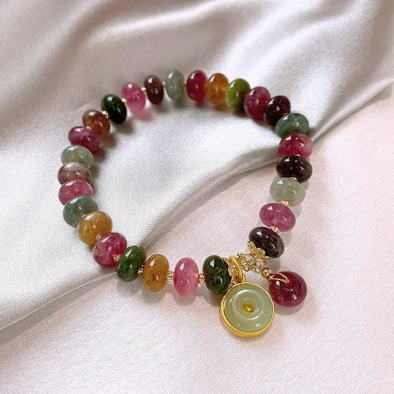 Colourful tourmaline rabbit pendant on a natural stone abacus bead bracelet.