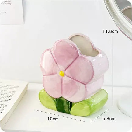 Ceramic flower pen holder storage box in a floral design on a desk