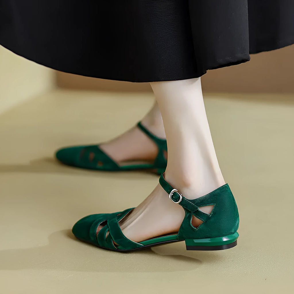 Apricot and green Roman sandals with round toe and buckle fastening.
