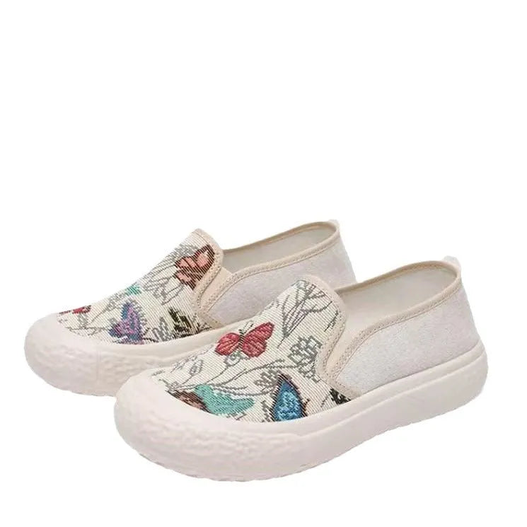 Women's Old Beijing slip-on canvas shoes in black with round toe and shallow mouth design on a white background.