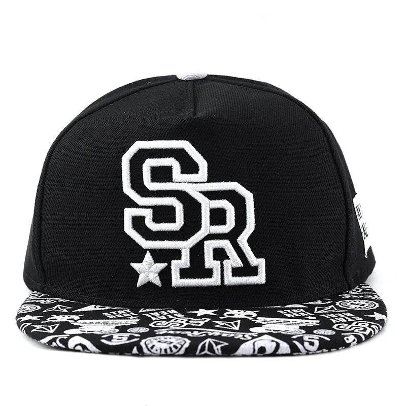 SR Black cotton baseball cap with front letter embroidery, showing adjustable snapback strap and dome crown.