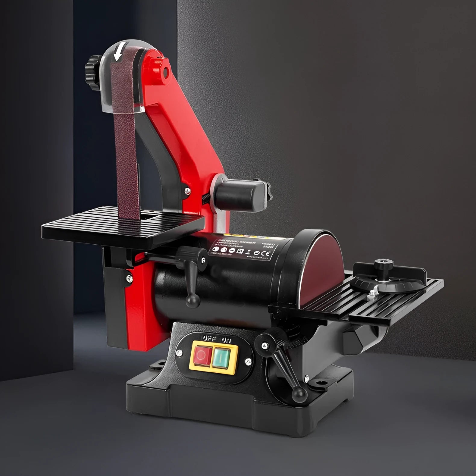 Small electric disc and belt sander for household use with EU plug and power cord on workbench