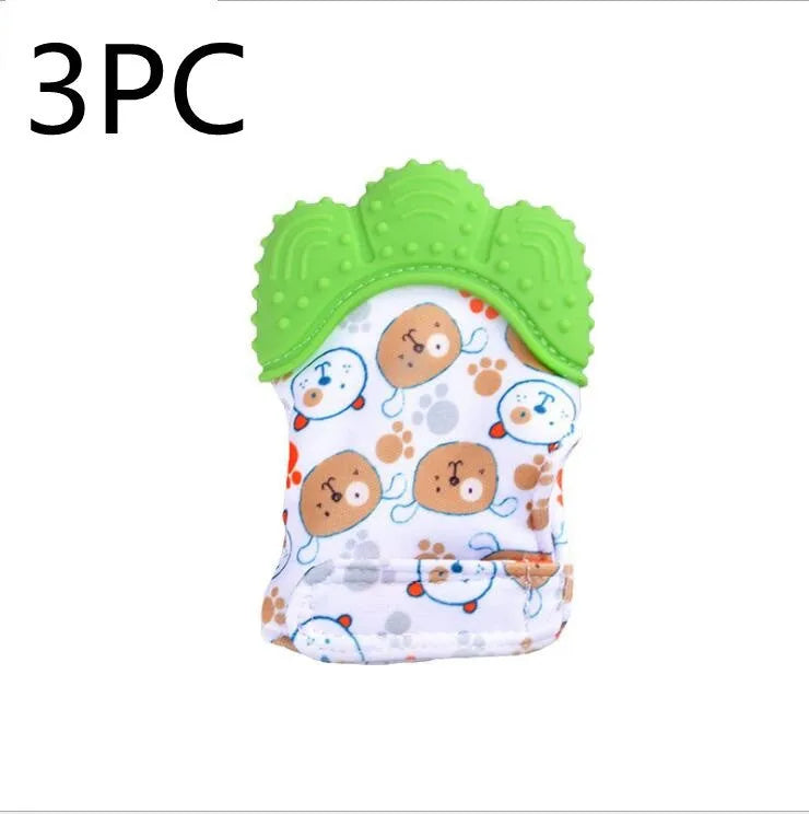 BPA-free silicone baby teether glove fastened with a white Velcro strap on a baby's hand