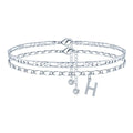 Silver-colour copper double-circle bead anklet with engraved text detail on a neutral background.