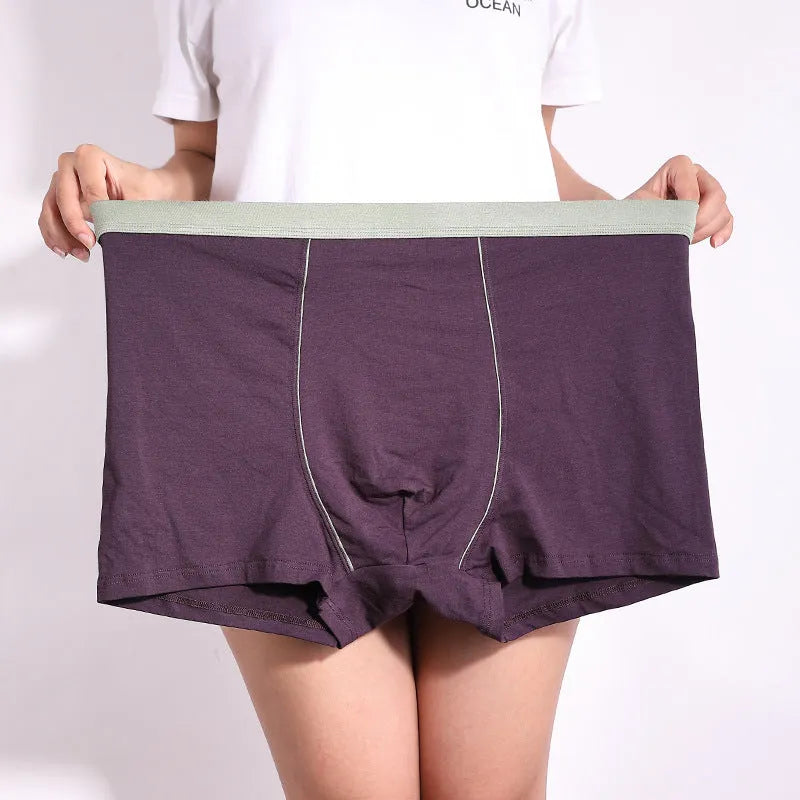 Men's oversized cotton baggy boxers in black, red, gray, blue and purple on a white background