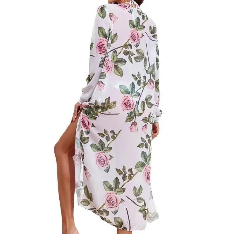 White printed three-piece women's bikini swimsuit set with bra, shorts, and a matching blouse.