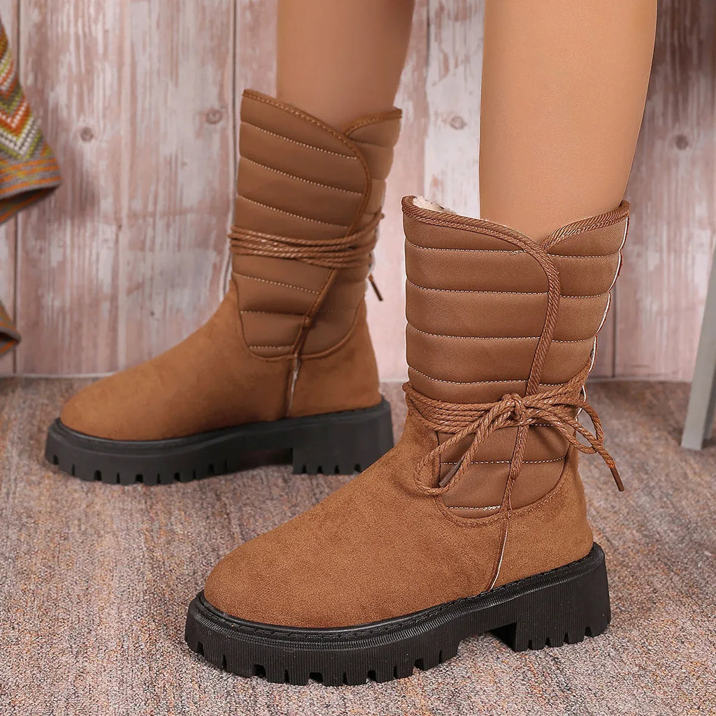 Women's black suede chunky heel snow boots with lace-up front and fleece lining.