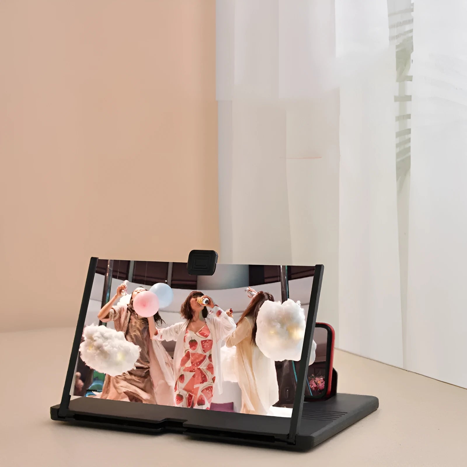 Mobile phone screen magnifier in black plastic with phone in stand, 12 inch size