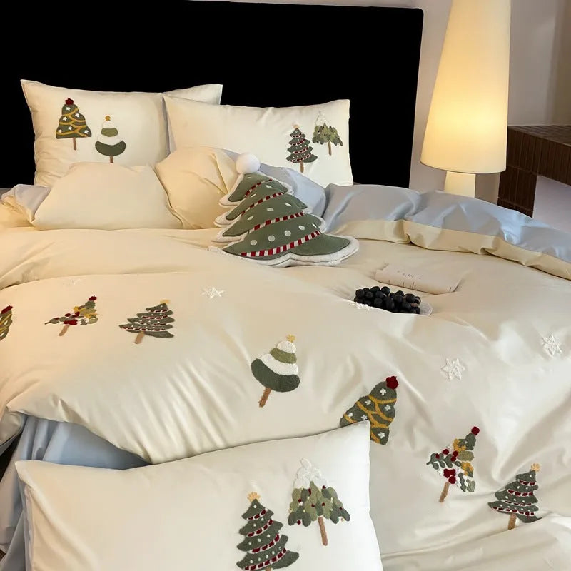 Cream Blue pure cotton duvet cover with raised towel embroidery of a Christmas tree and flowers, part of a four-piece bedding set.