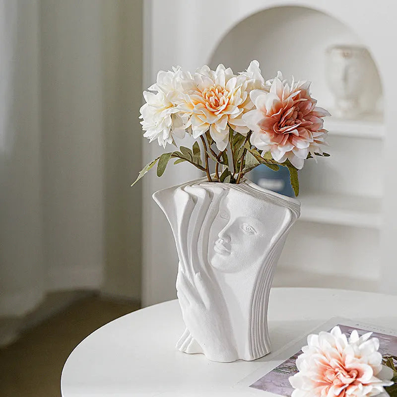Glazed ceramic book stand in a modern design, acting as a desktop organiser and decorative ornament.