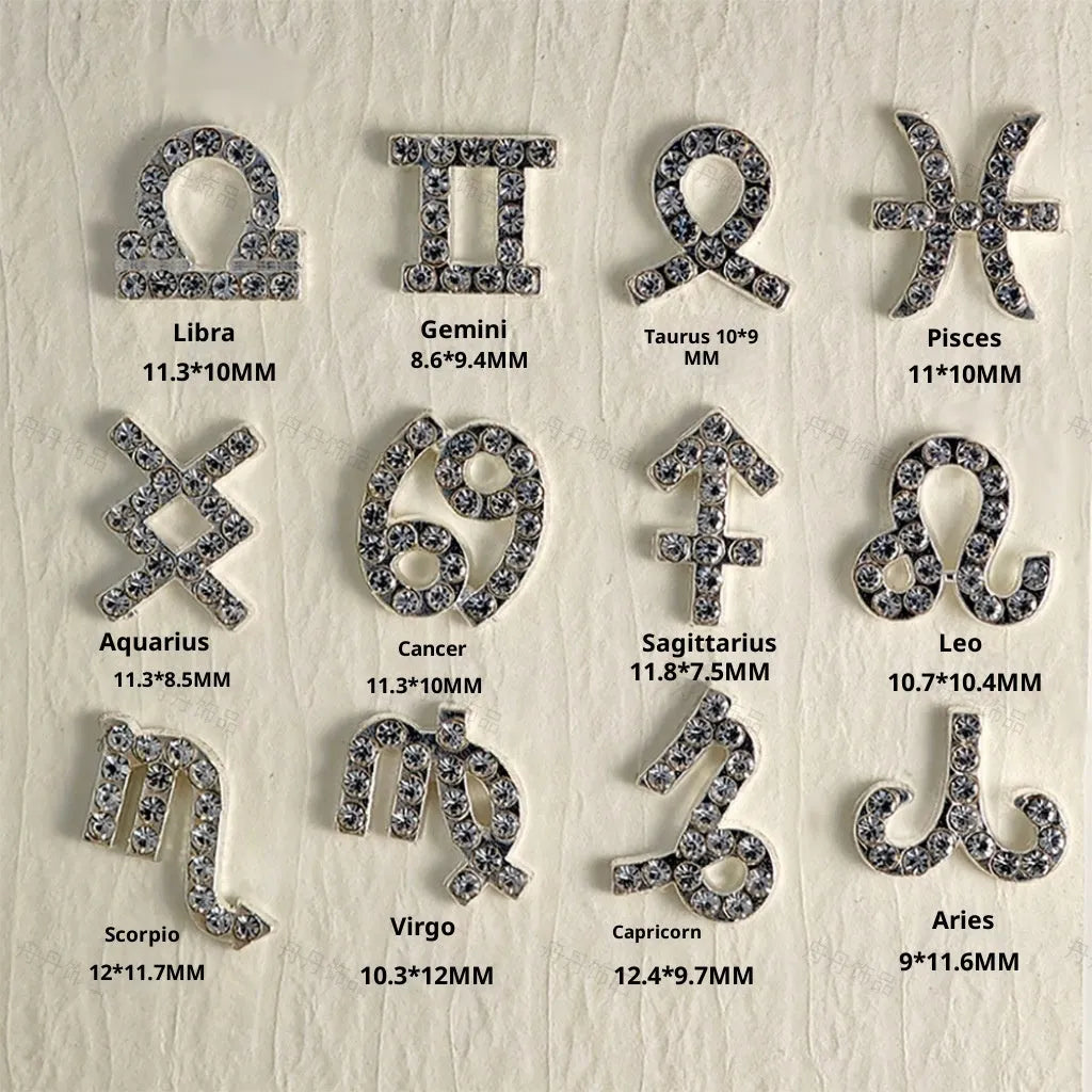 Twelve zodiac nail art accessories in alloy with diamond inlays, silver and gold finish, starry sky pattern.